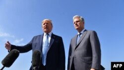 U.S. President Donald Trump(L)speaks next to new national security advisor Robert O'Brien on September 18, 2019 at Los Angeles International Airport in Los Angeles, California.