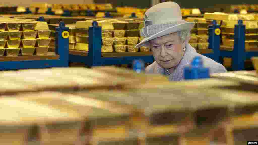Britain's Queen Elizabeth tours a gold vault during a visit to the Bank of England in London's financial district. (Reuters/Eddie Mulholland)