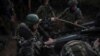 Ukrainian soldiers with the 148th Separate Artillery Zhytomyr Brigade of the Armed Forces prepare to fire an M777 Howitzer toward Russian troops at a position on the front line on June 9, 2025.