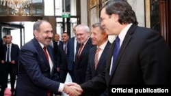 Austria -- Armenian Prime Minister Nikol Pashinian greets the U.S., Russian and French co-chairs of the OSCE Minsk Group before talks with Azerbaijan's President Ilham Aliyev, Vienna March 29, 2019.