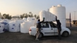 Iran -- People shop water storage tanks following a drought crisis in Tehran, Iran