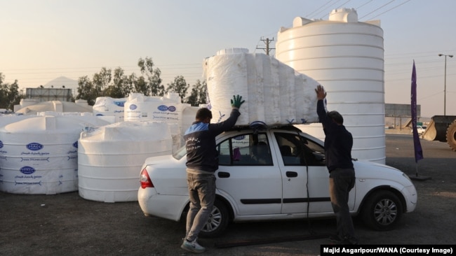 People purchase water storage tanks amid the drought crisis in Tehran on November 10.