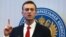 Russian oppositionist Aleksei Navalny talks to reporters before the Central Election Commission's decision was announced on December 25. 