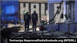 Rescuers work in the aftermath of a Russian strike on a clinic in Ukraine's Zaporizhzhya on December 10.