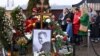 People pay tribute at the grave of late Russian opposition leader Aleksei Navalny in Moscow on the day of Russia's presidential election on March 17. 