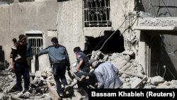 Rescue workers working in eastern Ghouta, Syria