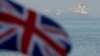 ابرنفتکش گریس ۱ در پس‌زمینه پرچم جبل‌الطارق