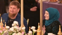 Chechnya -- Chechen leader Ramzan Kadyrov (L) and his wife Medni attend a show of the Firdaws fashion house led by their daughter Aishat Kadyrova (not pictured) in Grozny, March 1, 2017