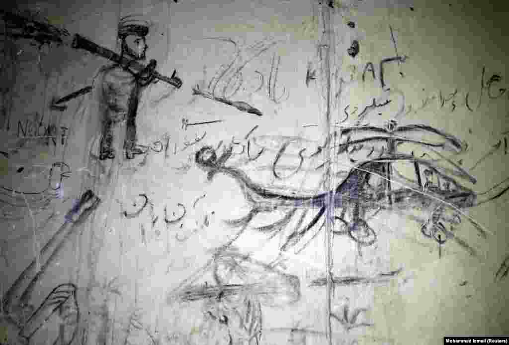 A sketch of an Afghan militant firing a rocket-propelled-grenade at a helicopter in the Darul Aman Palace in Kabul, photographed in 2016.