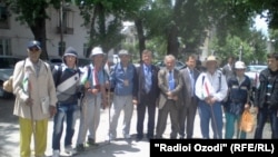 The men, along with other locals, posed for a group picture before they set off from Kulob, Tajikistan.