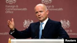 British Foreign Secretary William Hague was speaking after foreign ministers from the Friends of Syria group met with Syrian opposition leaders in London on October 22 to persuade them to attend a major peace conference in Geneva next month.