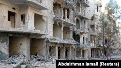 Алеппоның көтерілісшілер бақылауындағы бомбалаудан қираған ғимараттар. Сирия, 19 қазан 2016 жыл.
