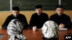Female students in head scarves attend classes at the Grozny State Oil Institute in the capital of the Russian Caucasus region of Chechnya in March 2011.