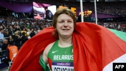 Nadzeya Astapchuk celebrates after winning the women's shot-put final at the London Olympic Games.