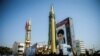 A display featuring missiles and a portrait of Iranian Supreme Leader Ayatollah Ali Khamenei is seen at Baharestan Square in Tehran on September 27, 2017.
