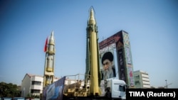 IRAN -- A display featuring missiles and a portrait of Iran's Supreme Leader Ayatollah Ali Khamenei is seen at Baharestan Square in Tehran, September 27, 2017