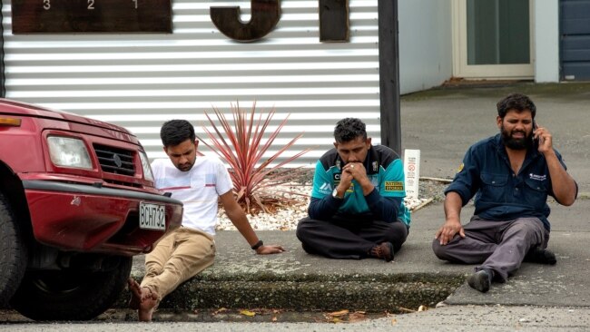 Members of the public react following a deadly mass shooting at the Al Noor mosque in Christchurch, New Zealand, on March 15. 