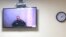 Russian opposition leader Aleksei Navalny is seen on a screen during a court hearing on May 31.