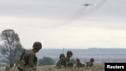 Kyrgyzstan -- Servicemen take part in the Collective Security Treaty Organisation (CSTO) military exercises outside Bishkek, 21Sep2011