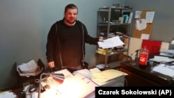 Rafal Gawel stands in his office in Warsaw, shortly after it was raided in February 2017 by the police, who seized computers.