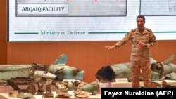Saudi defence ministry spokesman Colonel Turki bin Saleh al-Malki displays pieces of what he said were Iranian cruise missiles and drones recovered from the attack site that targeted Saudi Aramco's facilities. Sept. 18, 2019