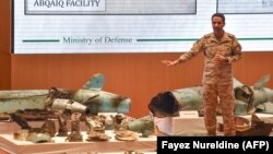 Saudi defense ministry spokesman Colonel Turki bin Saleh al-Malki displays pieces of what he said were Iranian cruise missiles and drones recovered from the attack site that targeted Saudi Aramco's facilities. September 18, 2019