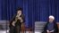A handout picture released by the official website of the Iranian supreme leader Ayatollah Ali Khamenei shows him (L) speaking during the swearing-in ceremony of Iranian President Hasan Rouhani (R) in Tehran on August 3, 2017