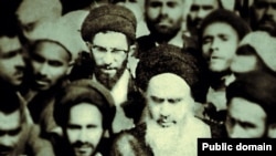 In step with the times? A photo from the "Khamenei.ir" Facebook page shows current Supreme Leader Ali Khamenei (with glasses) behind Islamic Republic of Iran founder Ayatollah Ruhollah Khomeini (front with white beard).