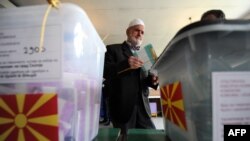 A man casts his ballot at a polling station in Skopje.