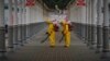Russian Emergency Situations Ministry workers sanitize a railway station in Moscow on June 11 amid a steep increase in infections.