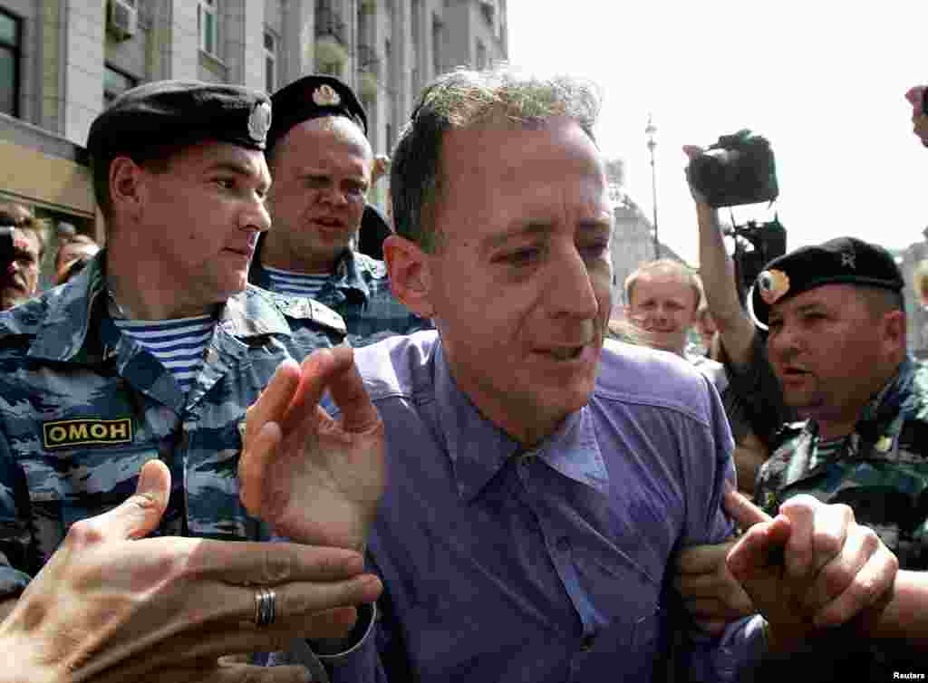 Tatchell, moments after the punch, being detained by Russian police. The images of nonviolent protesters being attacked with near impunity ushered in a new era in Russia. Far right groups and Orthodox Christian extremists seemed to have been given carte blanche for violence against gay activists.
