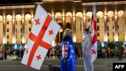 Georgian anti-government demonstrators protest outside Georgia's parliament in central Tbilisi (file photo)