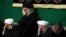 Iran's Supreme Leader Ali Khamenei (C), Iranian President Hassan Rouhani(2nd R) and the top IRGC commander Mohammad Ali Jafari, in a religious ceremony in Tehran on March 2, 2017.