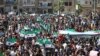 Syrian protesters wave their national flag as they demonstrate against the regime and its ally Russia in the rebel-held city of Idlib on September 7.