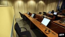 A view of the empty seat where Radovan Karadzic was supposed to sit while attending the start of his trial at the War Crimes Tribunal in The Hague.