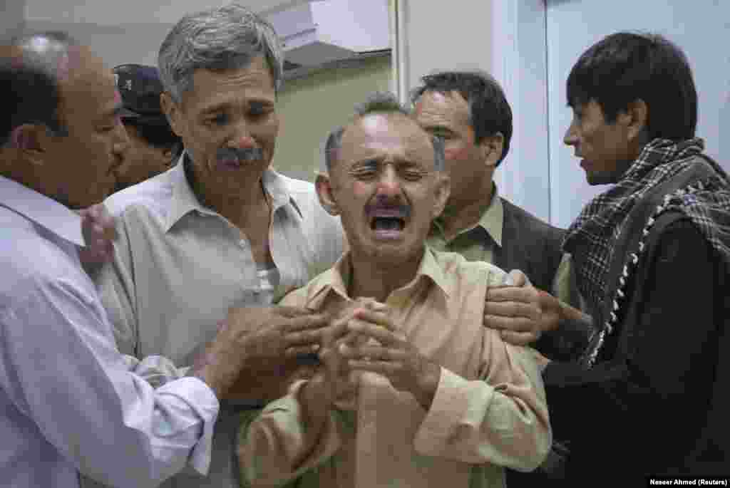 A Hazara man weeps over the body of a relative after gunmen killed 13 people as they headed to work in October 2011. Pakistan&rsquo;s Hazara are particularly vulnerable to sectarian terror due to their distinctive appearance.