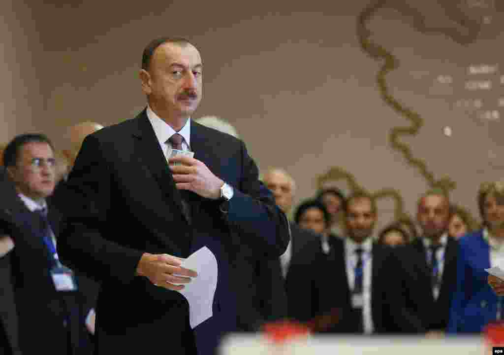 President Ilham Aliyev arrives at a polling station in Baku to vote on October 9.