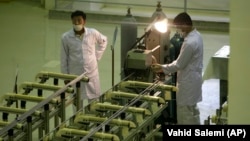 Iranian technicians work at a facility that produces uranium fuel, near the city of Isfahan. (file photo)