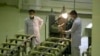 FILE - In this April 9, 2009 file picture Iranian technicians work at a new facility producing uranium fuel for a planned heavy-water nuclear reactor, just outside the city of Isfahan, 255 miles (410 kilometers) south of the capital Tehran. Iran is laggi