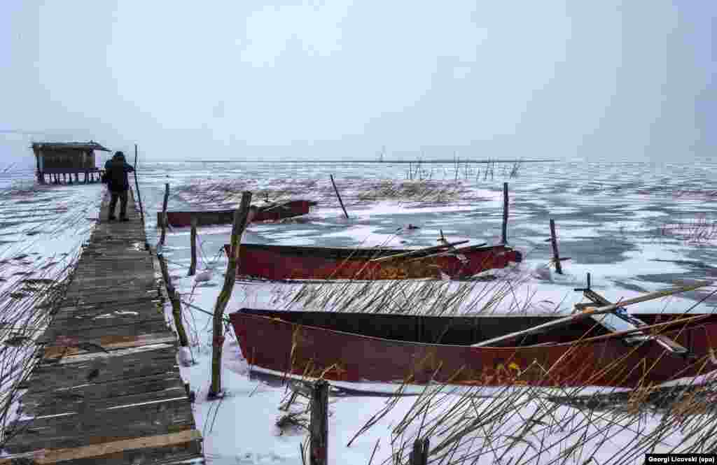 A fishing boat is stuck in the frozen Dojran Lake near the Greek border with Macedonia. (epa/Georgi Licovski)