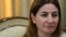 Lawmaker Vian Dakhil says she will return to the Iraqi parliament once she is fully recovered from injuries suffered in a helicopter crash on Mount Sinjar in August.