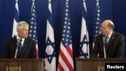 U.S. Defense Secretary Chuck Hagel (left) and his Israeli counterpart Moshe Yaalon at a joint news conference at Kirya base in Tel Aviv on April 22. 