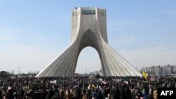 Iranians attend celebrations on Tehran's Azadi (Freedom) Square to mark the 37th anniversary of the Islamic Revolution on February 11.