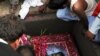 Mourners at the burial of slain Pakistani Minister for Minorities Shahbaz Bhatti at his family graveyard in his native village Khushpur, Pakistan, on March 4.