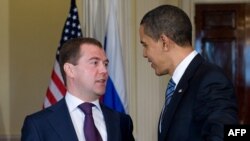 U.S. President Barack Obama (right) speaks with Russian President Dmitry Medvedev during a meeting at the U.S. ambassador's residence in London on April 1.