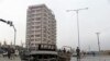 Members of Afghan security forces stand guard at the site of an attack in Kabul on December 20.