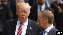 U.S. President Donald Trump (left) speaks with European Council President Donald Tusk on their way to the Hotel San Domenico during the G7 summit, in Taormina on May 26.