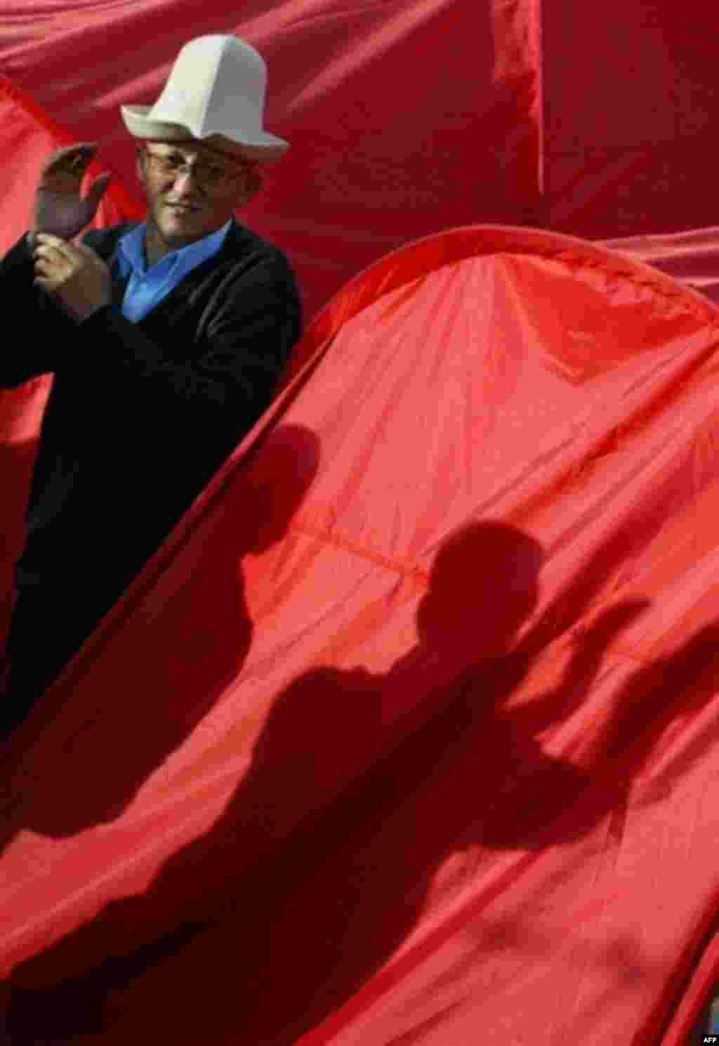 An opposition supporter pictured in the tent city set up by the opposition in central Bishkek (AFP) - When the Kyrgyz opposition toppled Askar Akaev in March 2005, one complaint was that the presidency had too much power. For the next 18 months, the division of power remained unresolved, but in November the Kyrgyz again showed the power of protest, forcing President Kurmanbek Bakiev to hand greater powers to parliament. However, unease about the country's direction remains.
