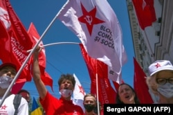 Supporters of Moldova's Communist and Socialist bloc attend an election rally in Chisinau on July 9.