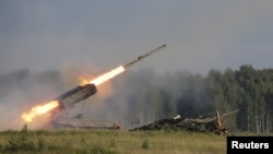 Russia -- A Russian TOS-1A multiple rocket launcher fires during the opening of the Army-2015 international military forum in Kubinka, outside Moscow, June 16, 2015